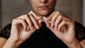 Cigarette being ripped in half 