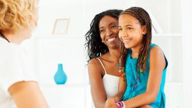 Image of mother and child talking with clinician Image of mother and child talking with clinician