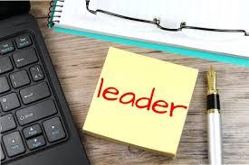 The word "Leader" on a sticky note