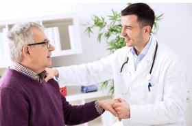 Doctor caring for elderly patient