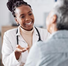 Healthcare provider speaking with a patient