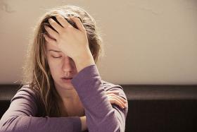 Woman experiencing fatigue from insomnia 