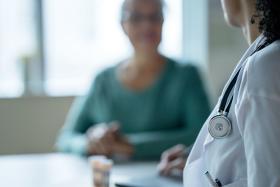 Clinician speaking with someone Clinician speaking with someone