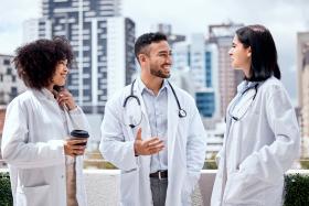 3 clinicians speaking to each other 