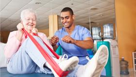 image of physical therapist instructing patient